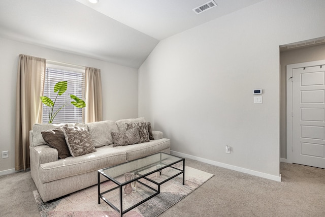 living room featuring lofted ceiling and light colored carpet