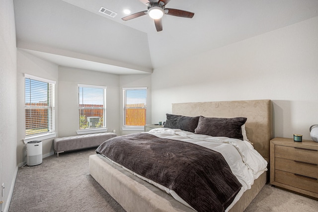 carpeted bedroom with vaulted ceiling and ceiling fan