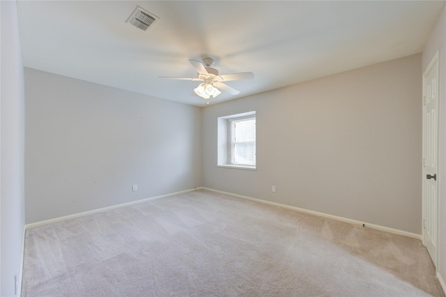 empty room with light carpet and ceiling fan