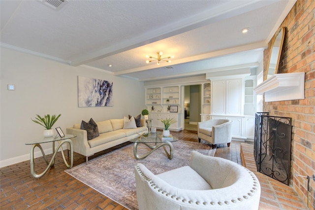 living room with beamed ceiling, a textured ceiling, a brick fireplace, and built in features