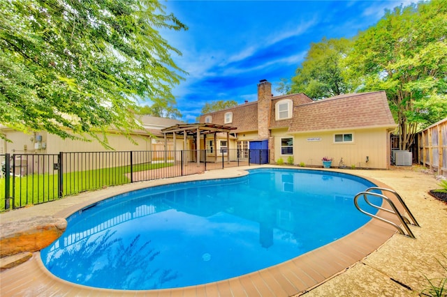 view of swimming pool with central AC unit and a pergola