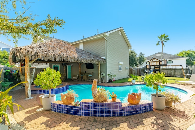 view of swimming pool with a patio area