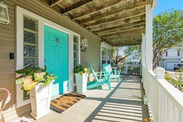 view of exterior entry featuring a porch