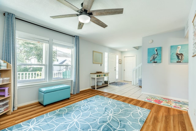 interior space with ceiling fan and hardwood / wood-style floors