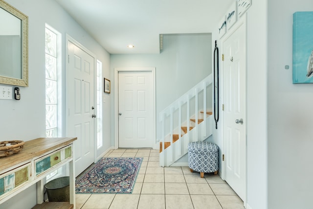 foyer with light tile patterned flooring