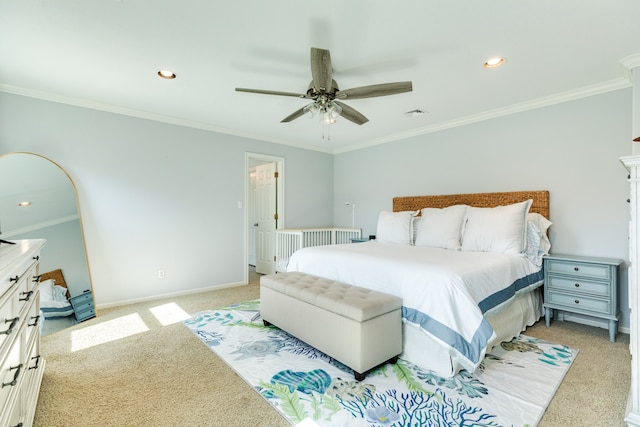 bedroom with ornamental molding, light colored carpet, and ceiling fan