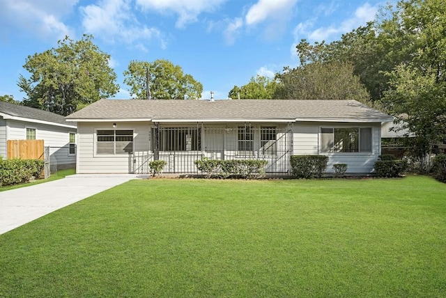 ranch-style house with a front lawn