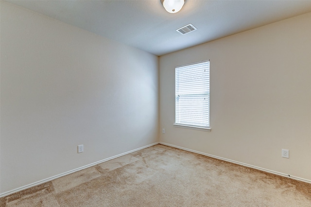 empty room with light colored carpet