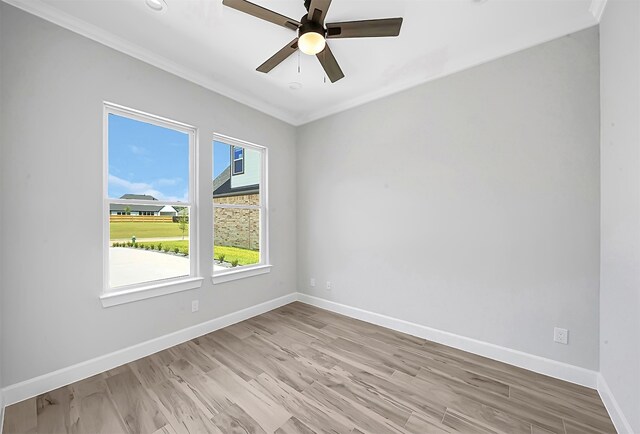 unfurnished room with ceiling fan, crown molding, and light hardwood / wood-style floors