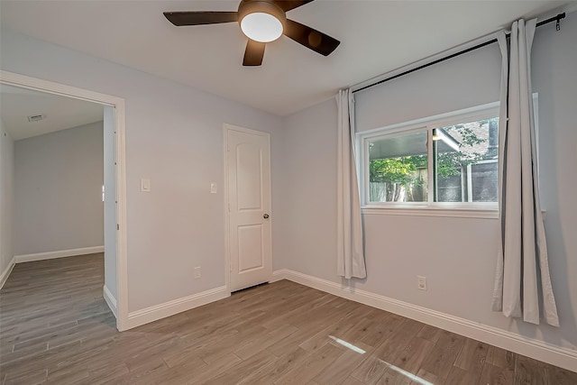 unfurnished bedroom featuring ceiling fan and light wood-type flooring