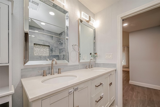 bathroom featuring vanity and hardwood / wood-style floors