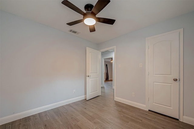 unfurnished bedroom with light wood-type flooring and ceiling fan