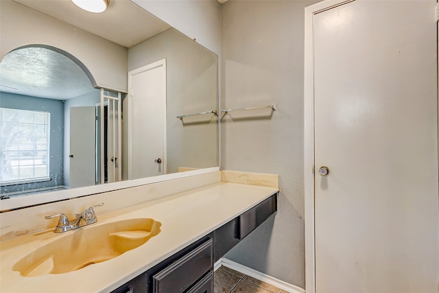 bathroom with vanity and tile patterned floors