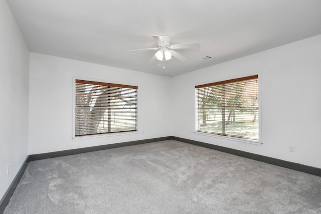 carpeted empty room with ceiling fan