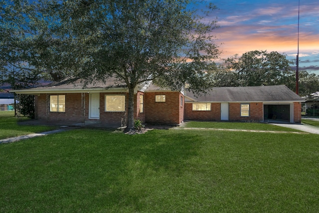 ranch-style house featuring a yard