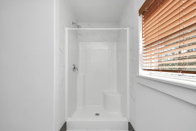 bathroom featuring a shower