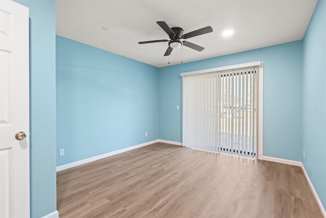 unfurnished room featuring light wood-type flooring and ceiling fan