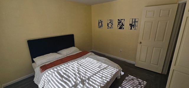 bedroom featuring dark hardwood / wood-style flooring