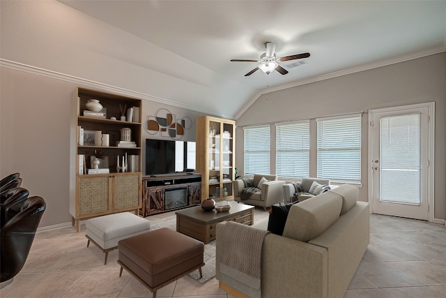 tiled living room with a wealth of natural light, vaulted ceiling, and ceiling fan