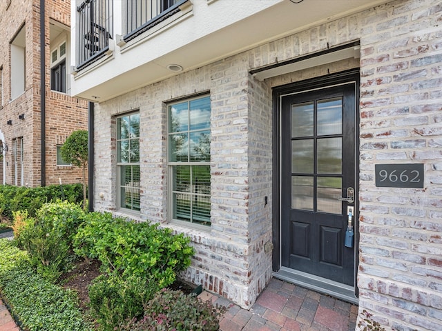 doorway to property with a balcony