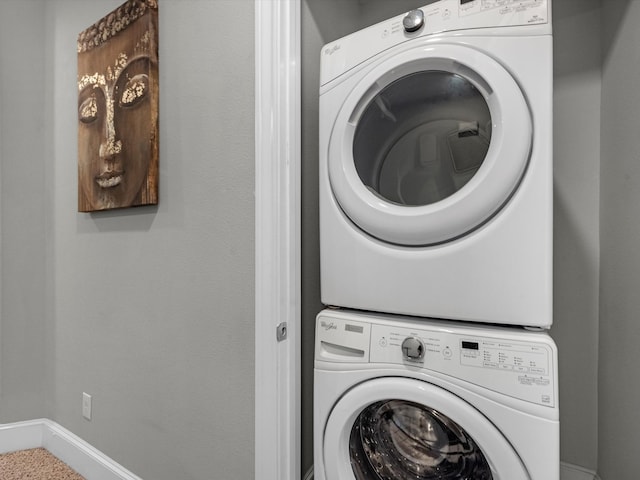 laundry room with stacked washer / drying machine