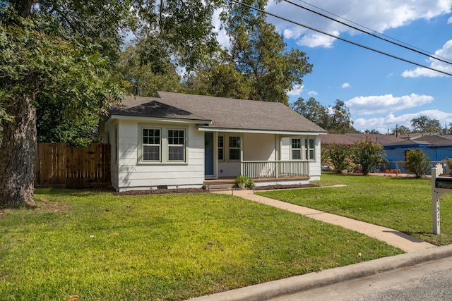 view of front facade featuring a front lawn and covered porch