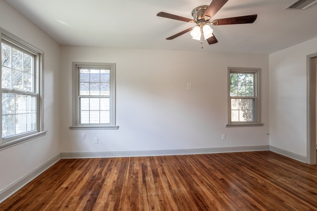 unfurnished room with ceiling fan, plenty of natural light, and dark hardwood / wood-style flooring