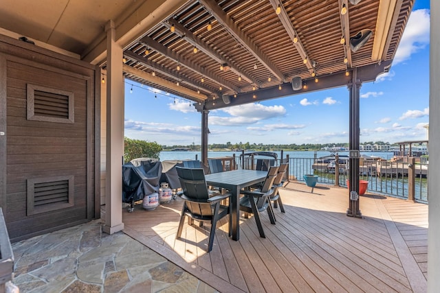 wooden deck featuring a water view