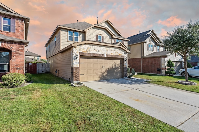 view of front of house featuring a lawn and a garage