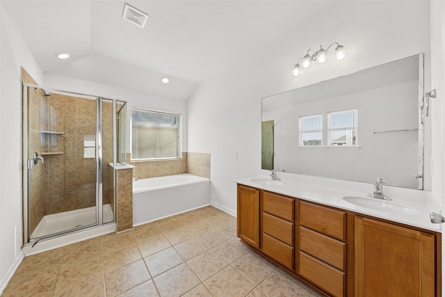 bathroom with lofted ceiling, tile patterned floors, vanity, and plus walk in shower