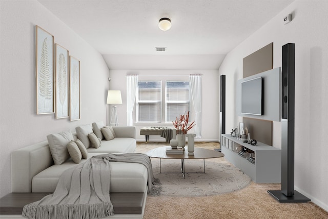 living room with lofted ceiling and light carpet