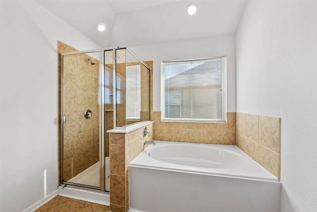 bathroom with shower with separate bathtub and tile patterned floors