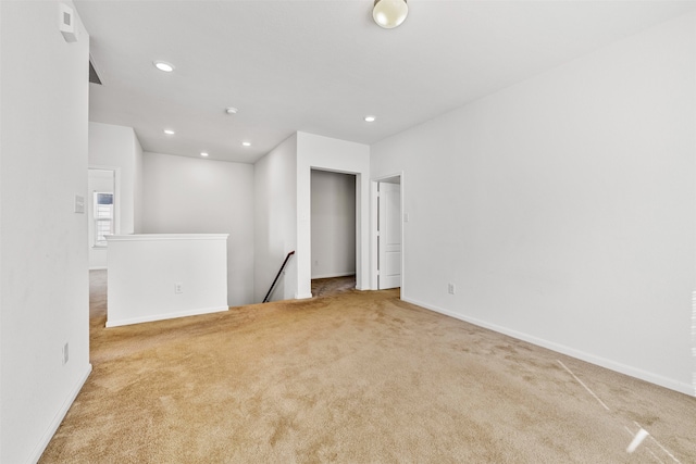 empty room featuring light carpet