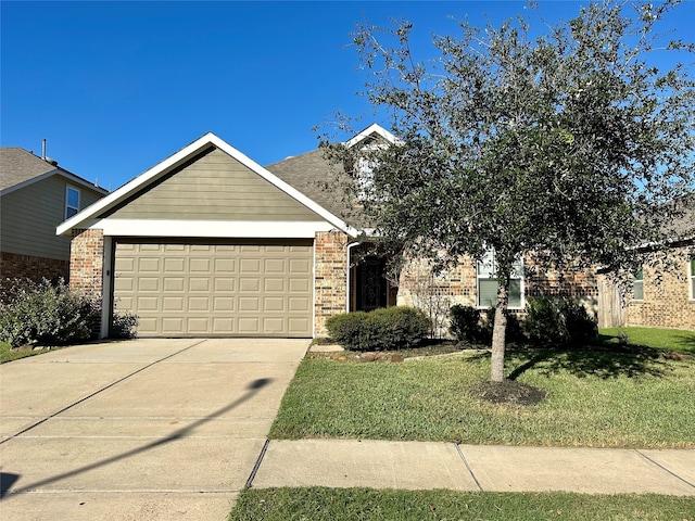 view of front of home with a garage and a front yard