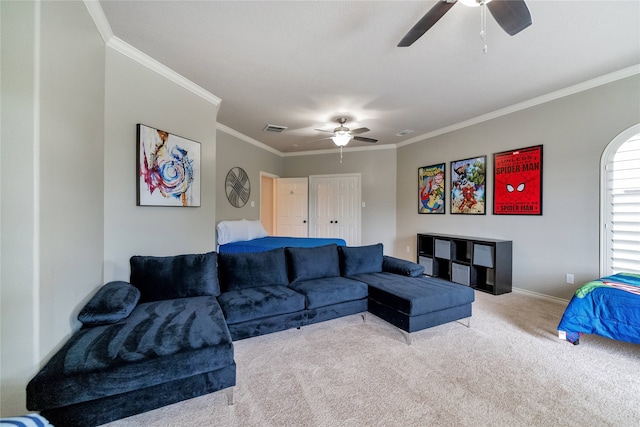 carpeted living room featuring crown molding and ceiling fan