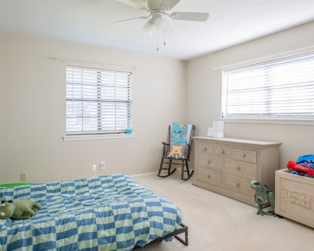 carpeted bedroom with ceiling fan