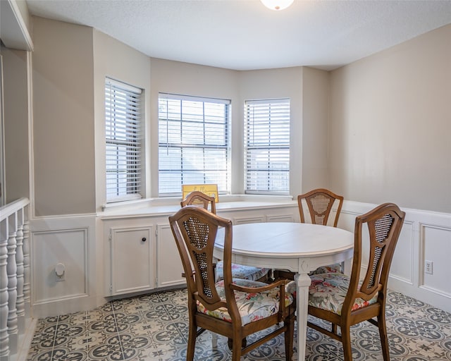 dining room with a textured ceiling