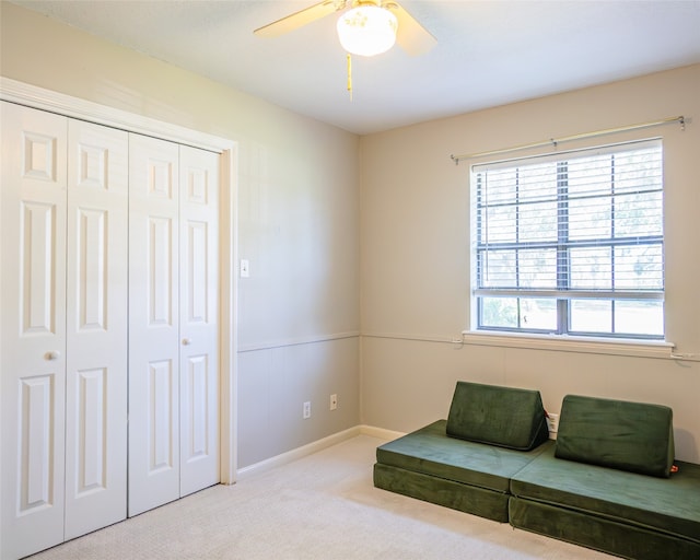 unfurnished room with ceiling fan and light colored carpet