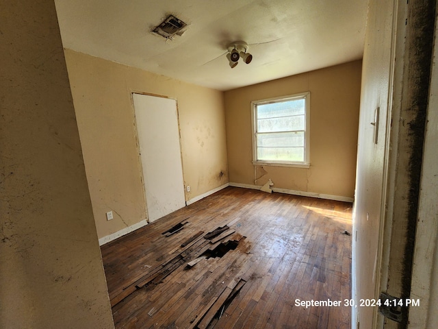 unfurnished room featuring hardwood / wood-style flooring and ceiling fan