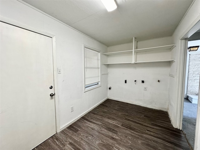 laundry area with dark wood-type flooring, plenty of natural light, and gas dryer hookup