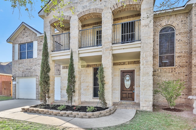 view of front of house with a garage and a balcony