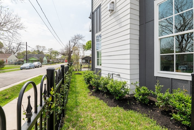 view of home's exterior with a yard