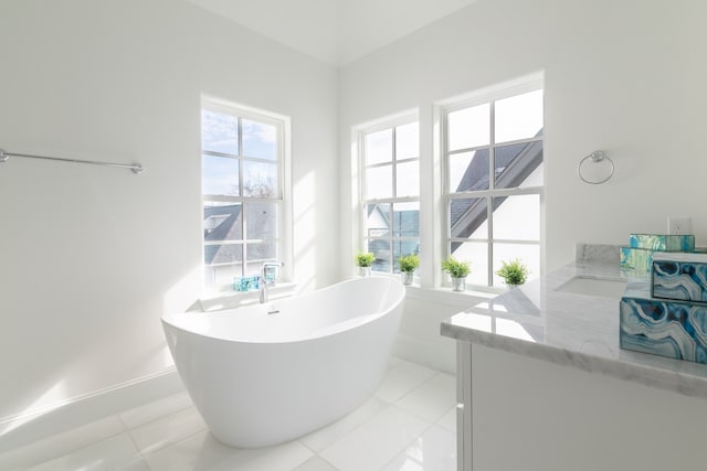 bathroom featuring a tub and tile patterned floors