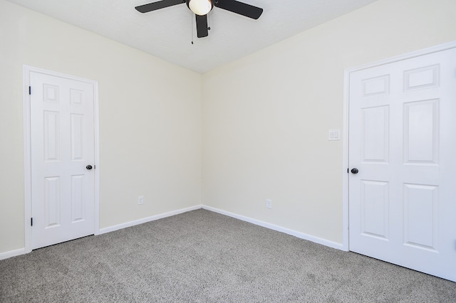 unfurnished room featuring carpet and ceiling fan