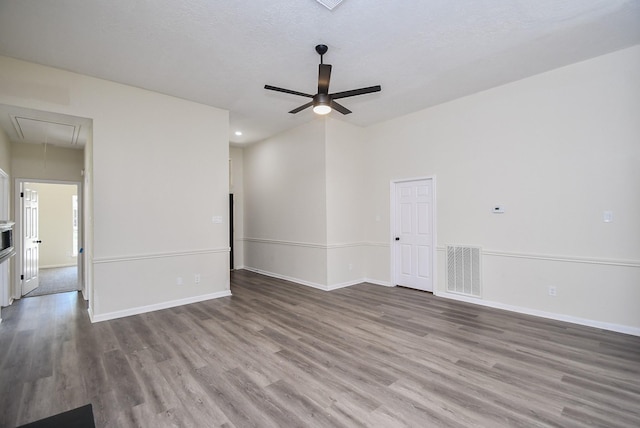 spare room with ceiling fan and wood-type flooring