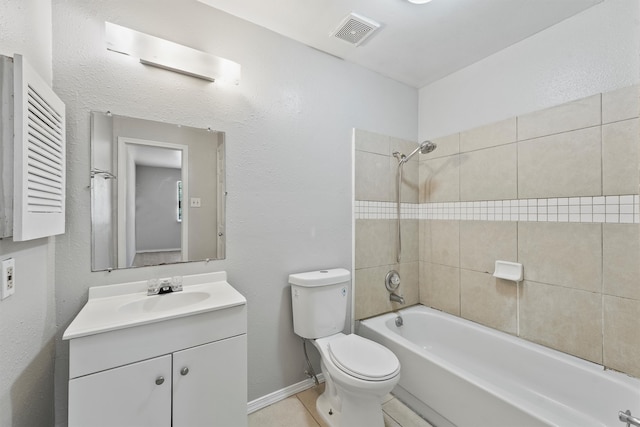 full bathroom with vanity, tiled shower / bath combo, toilet, and tile patterned floors