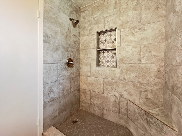 bathroom featuring tiled shower