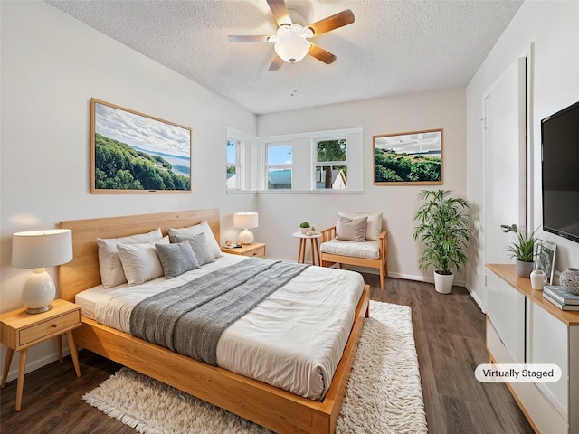 602 Meadowglen Dr, Baytown, TX 77521 - bedroom with a textured ceiling, baseboards, and wood finished floors