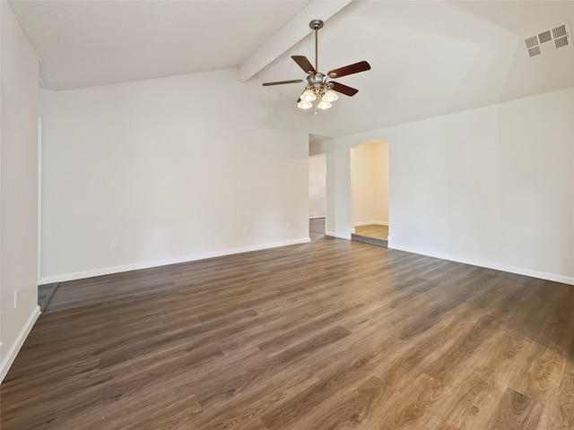 spare room featuring lofted ceiling with beams, ceiling fan, and dark hardwood / wood-style floors