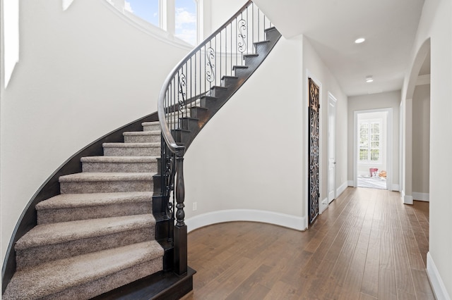 stairs with wood-type flooring